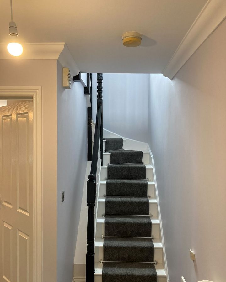 Hall and staircase in soft grey with a painted balustrade