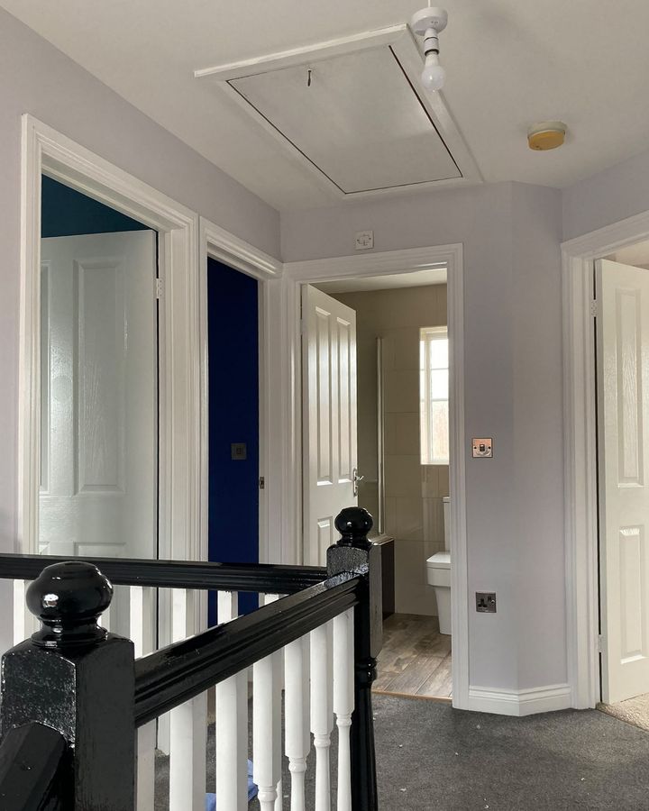Landing with freshly painted balustrade and doors